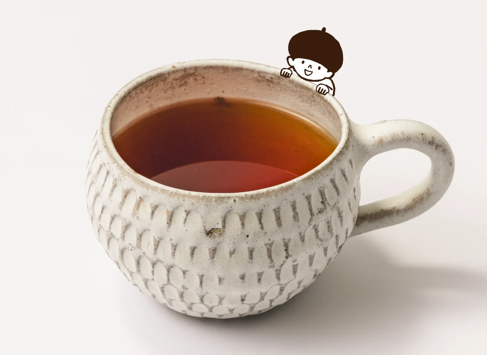 和紅茶のカップからTanが覗いてる画像